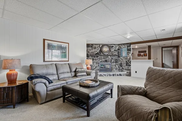a living room with furniture and a rug