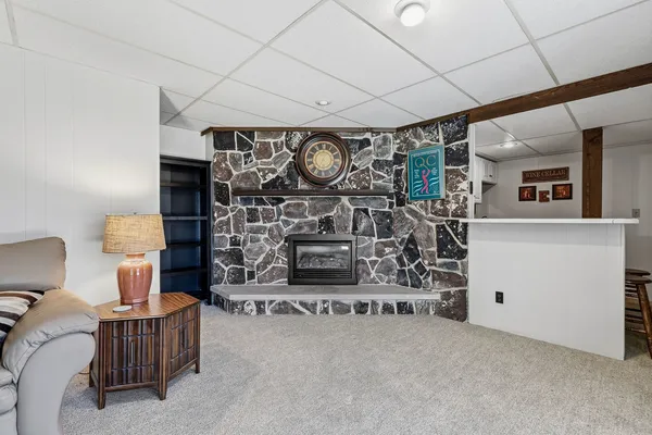 a view of a fireplace with racks on the wall