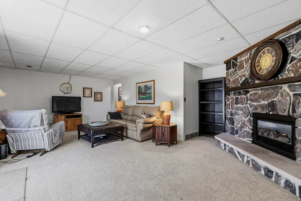a living room with furniture and a fireplace