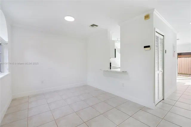 a view of room with hardwood floor and window