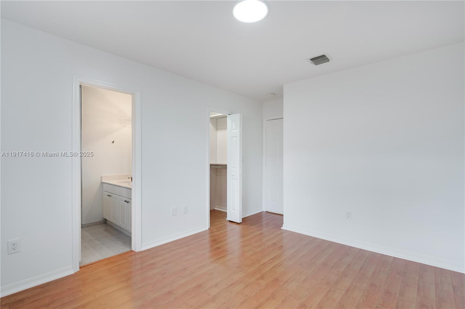 9481 Southwest 78th Avenue Miami, FL 33156 - Photo 23 of 45 a view of empty room with wooden floor