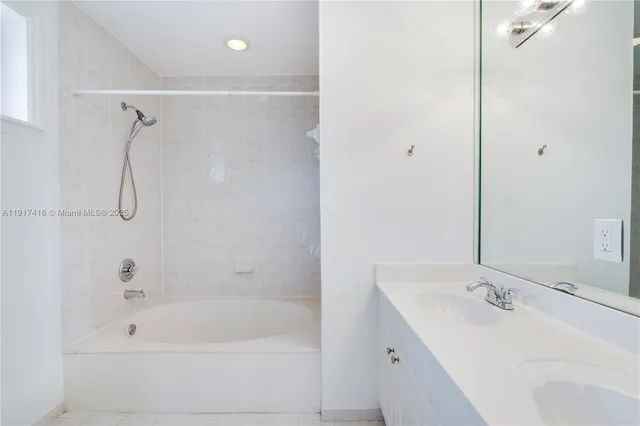 a spacious bathroom with a double vanity sink mirror and toilet