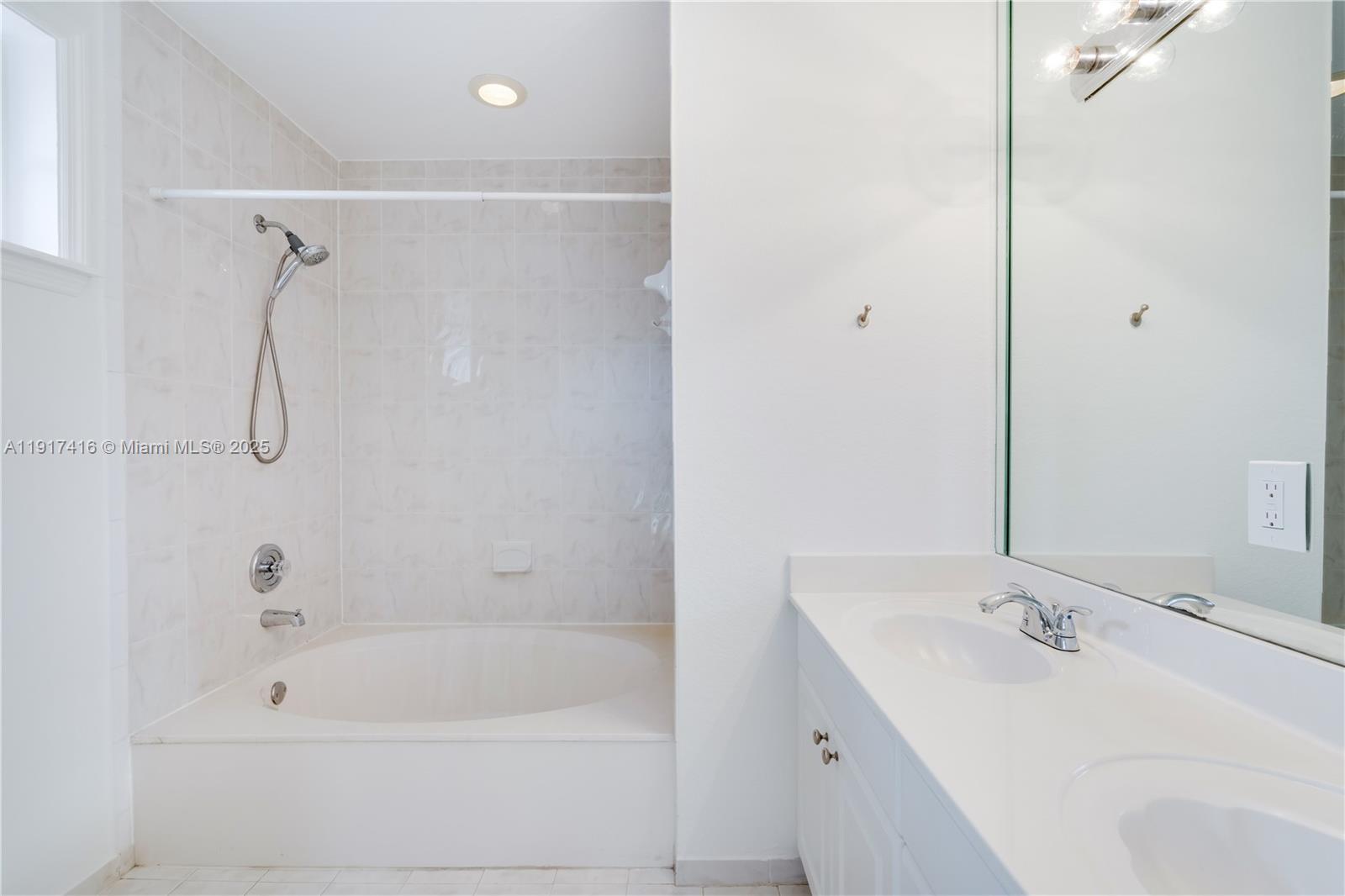 9481 Southwest 78th Avenue Miami, FL 33156 - Photo 25 of 45 a bathroom with a bath tub and a sink