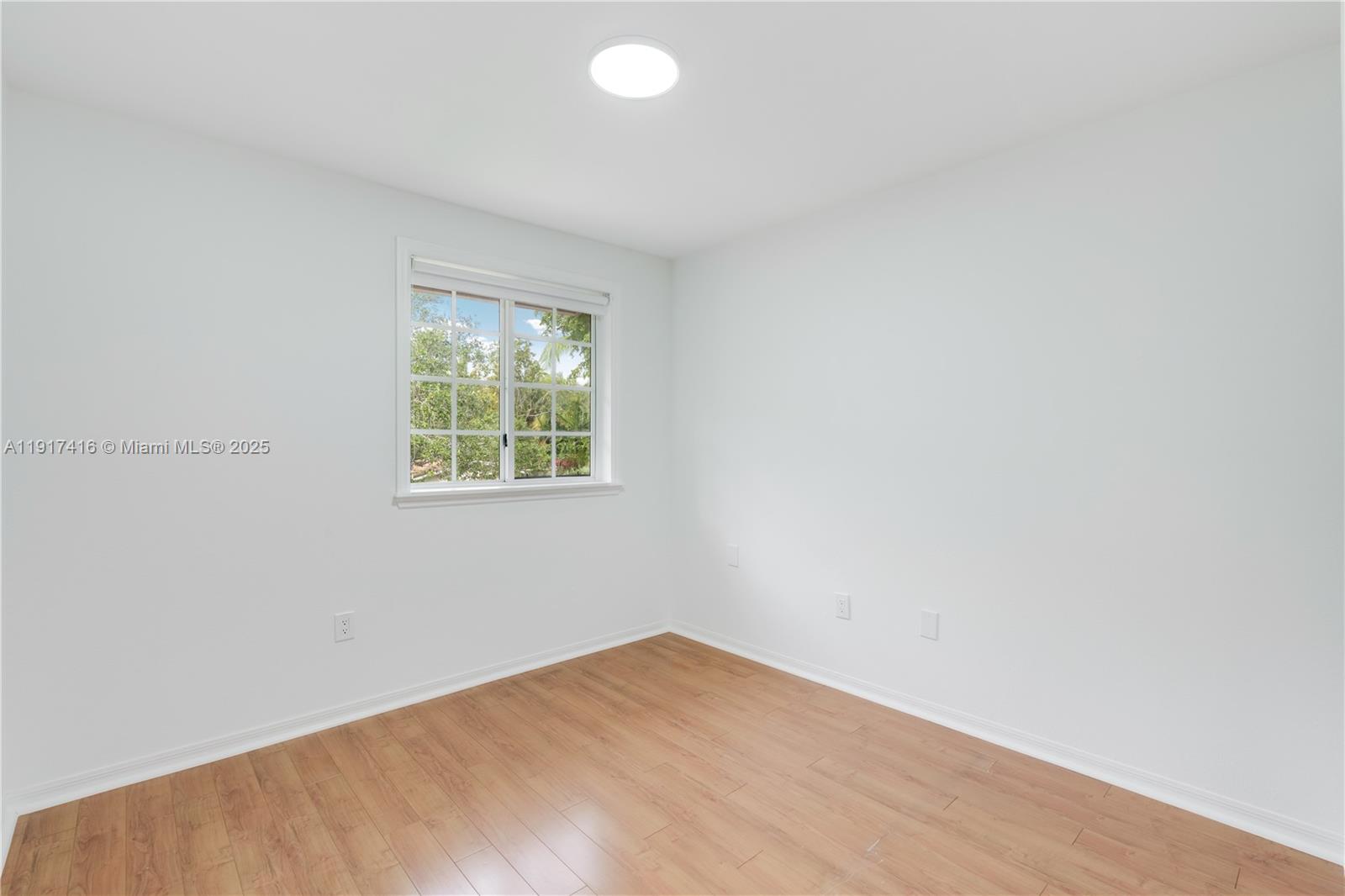 9481 Southwest 78th Avenue Miami, FL 33156 - Photo 28 of 45 an empty room with windows