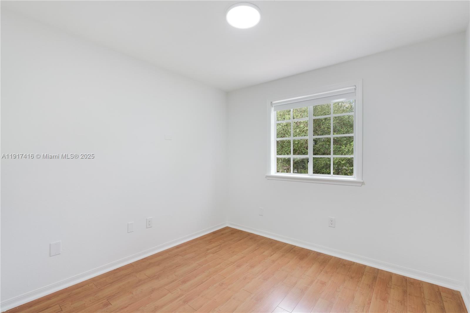 9481 Southwest 78th Avenue Miami, FL 33156 - Photo 30 of 45 an empty room with a window