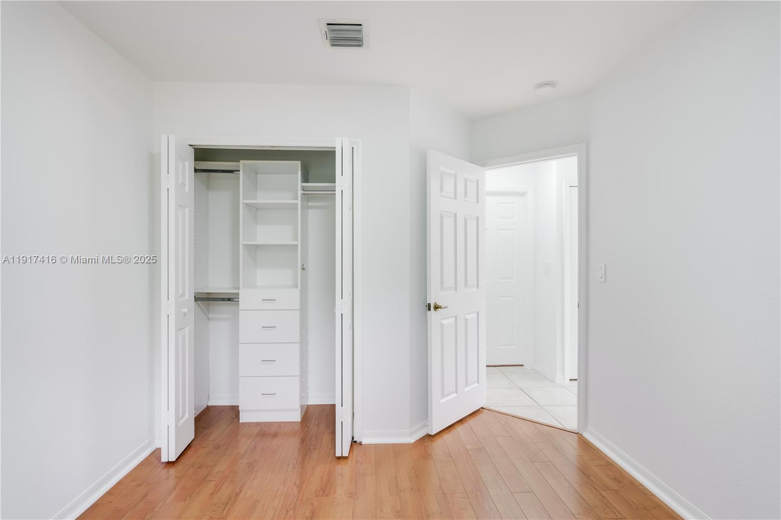 9481 Southwest 78th Avenue Miami, FL 33156 - Photo 31 of 45 a view of hallway with wooden floor