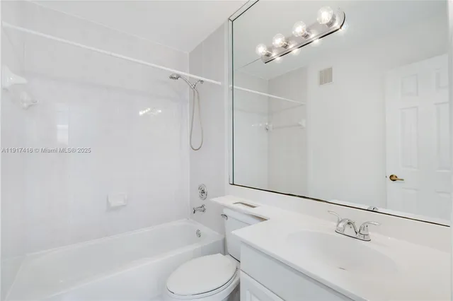 a bathroom with a shower a sink a toilet and bathtub