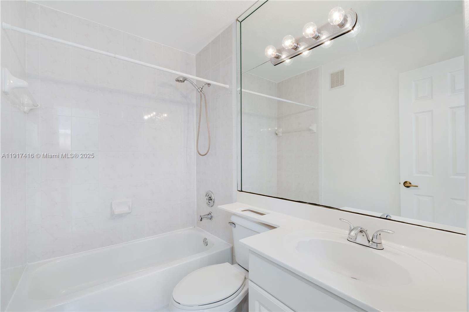 9481 Southwest 78th Avenue Miami, FL 33156 - Photo 32 of 45 a bathroom with a shower a sink and a mirror