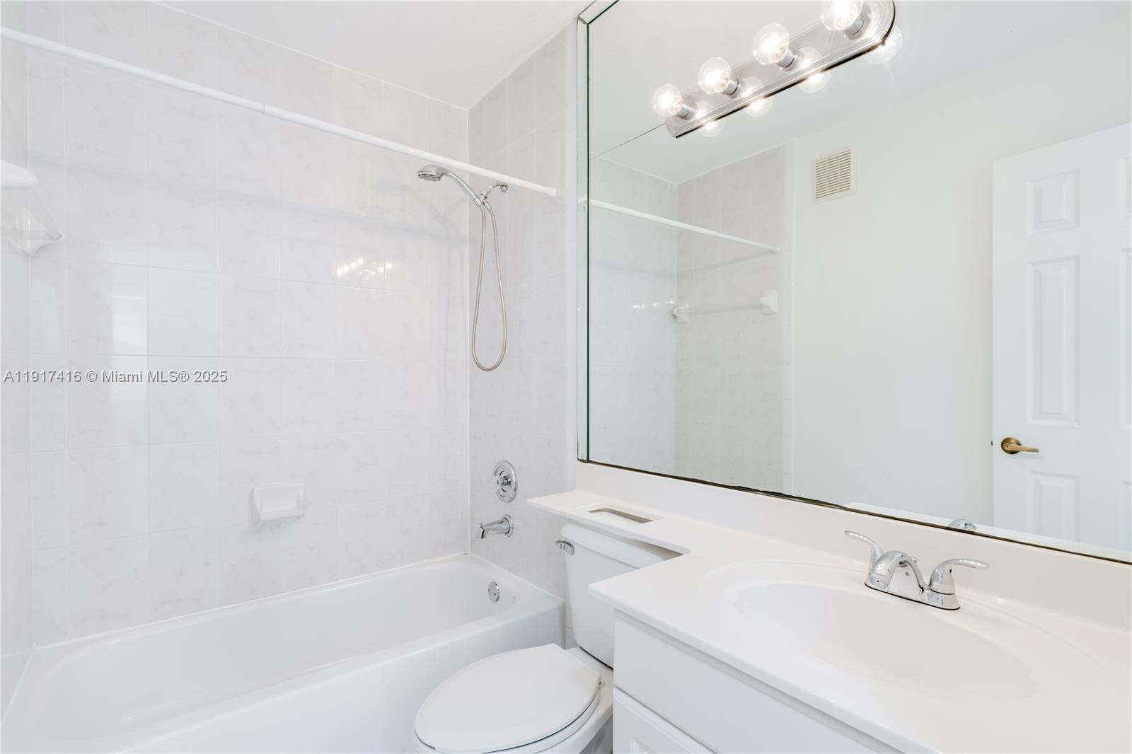 9481 Southwest 78th Avenue Miami, FL 33156 - Photo 33 of 45 a bathroom with a shower a sink a toilet and bathtub