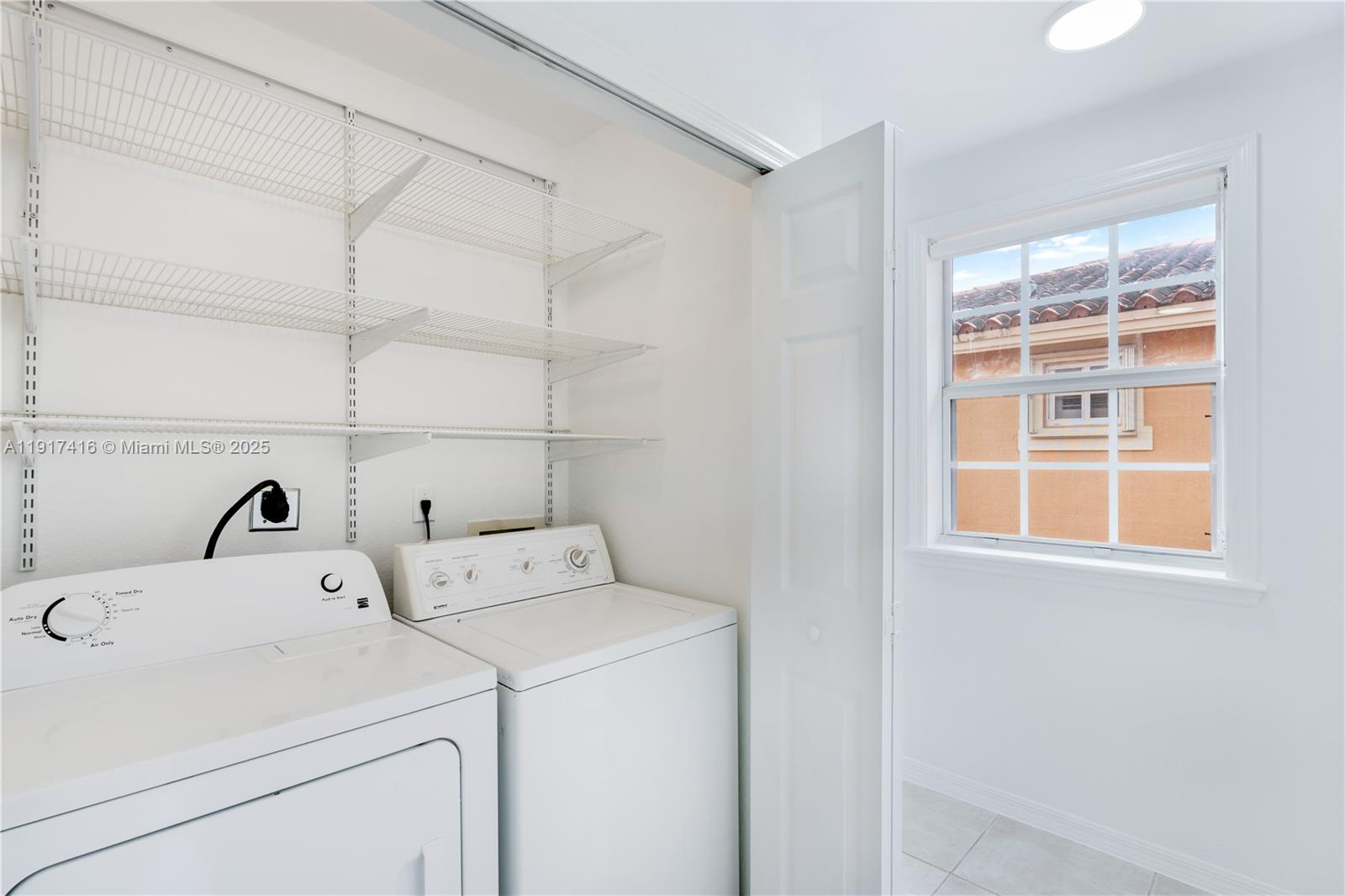 9481 Southwest 78th Avenue Miami, FL 33156 - Photo 35 of 45 a utility room with dryer and washer