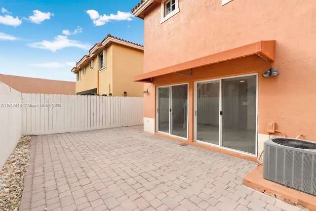 a backyard of a house with wooden floor