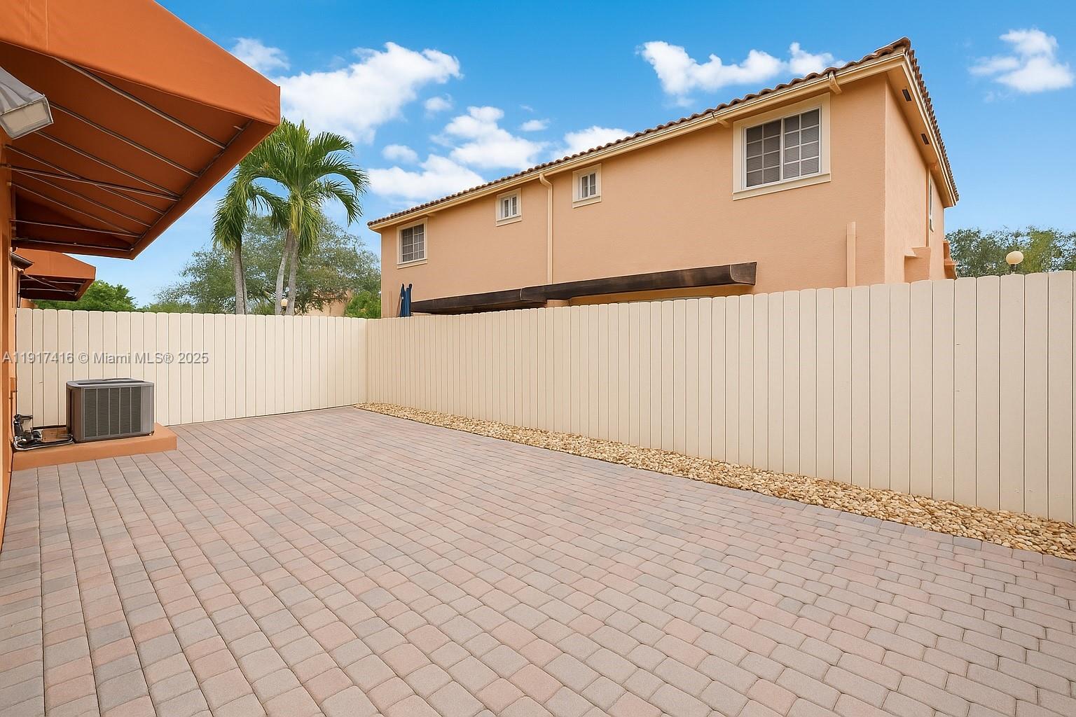 9481 Southwest 78th Avenue Miami, FL 33156 - Photo 38 of 45 a backyard of a house with wooden floor