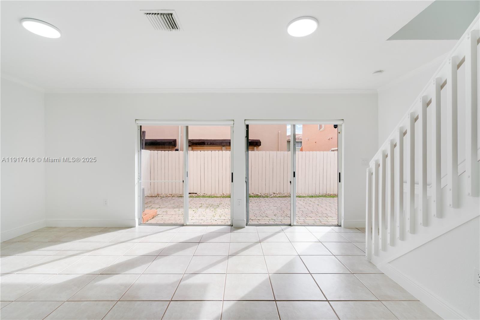 9481 Southwest 78th Avenue Miami, FL 33156 - Photo 4 of 45 a view of a livingroom with an empty space