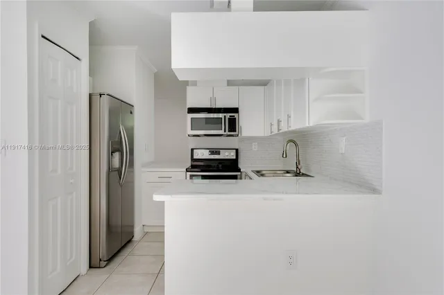 a view with a sink and cabinets