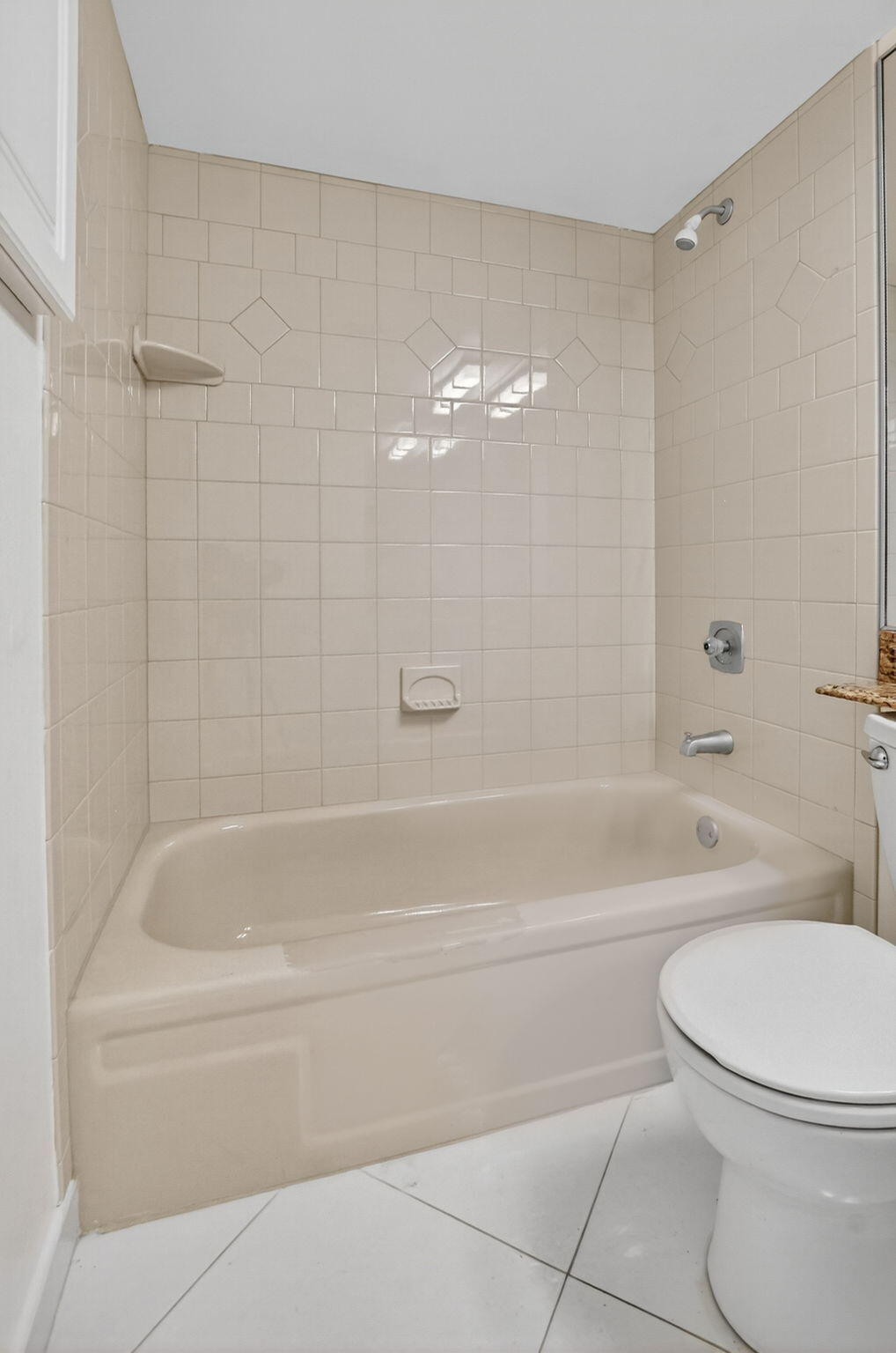 6620 Boca Del Mar Drive, Unit 706 Boca Raton, FL 33433 - Photo 20 of 41 a bathroom with a toilet and a bath tub
