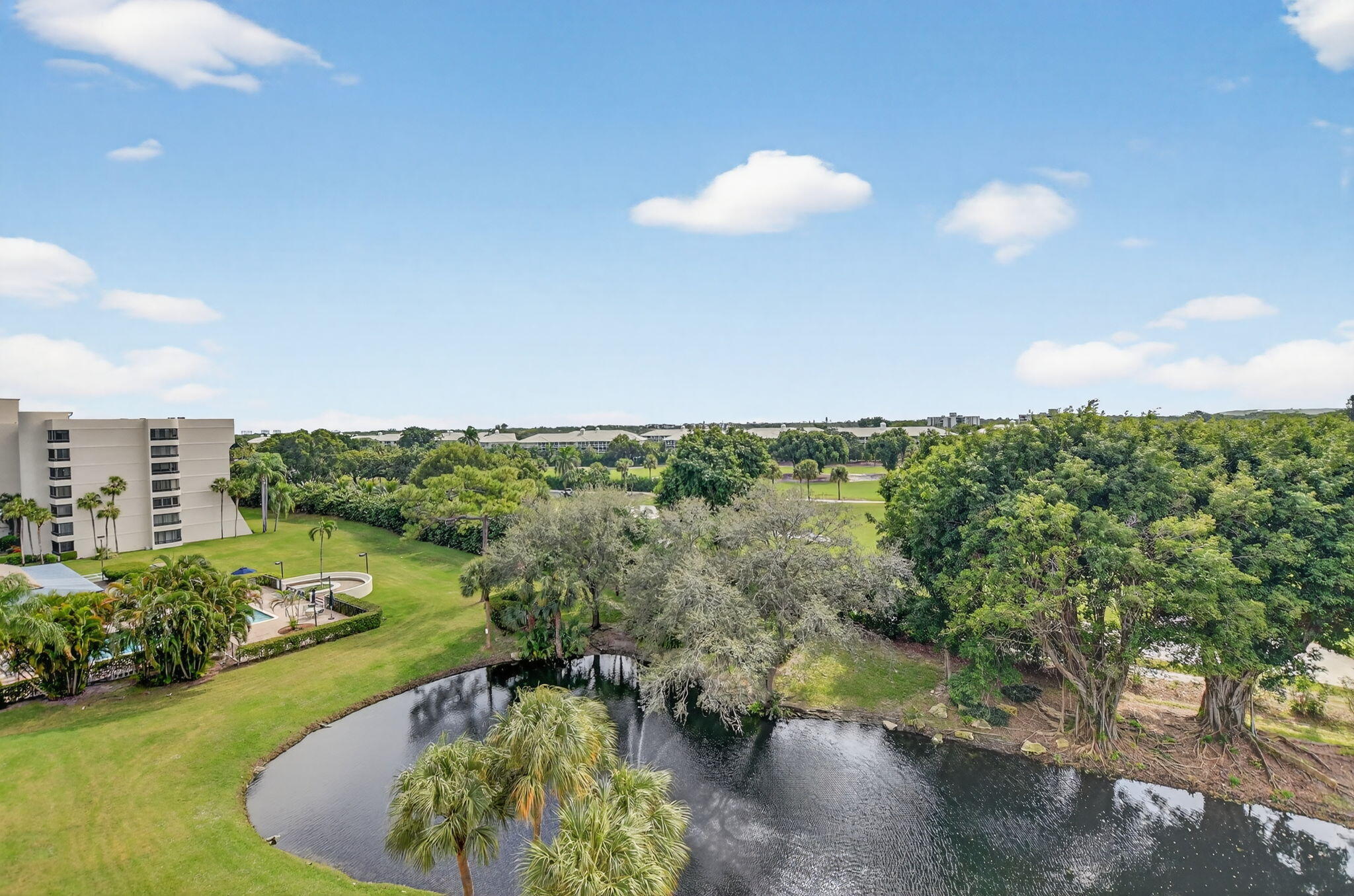 6620 Boca Del Mar Drive, Unit 706 Boca Raton, FL 33433 - Photo 25 of 41 a view of a lake with a yard