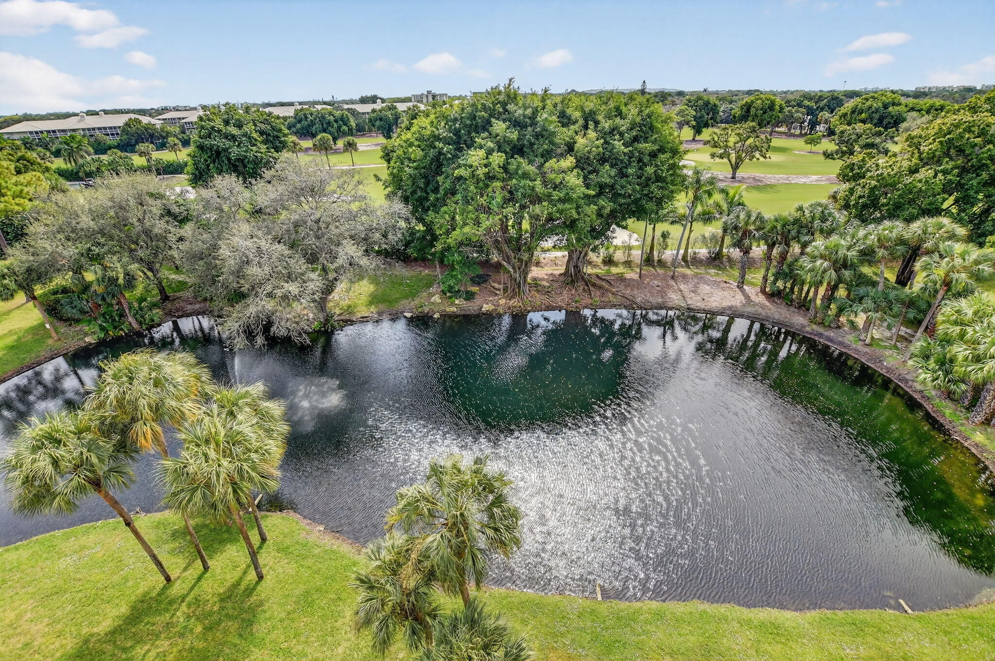 6620 Boca Del Mar Drive, Unit 706 Boca Raton, FL 33433 - Photo 28 of 41 a view of a lake with a yard