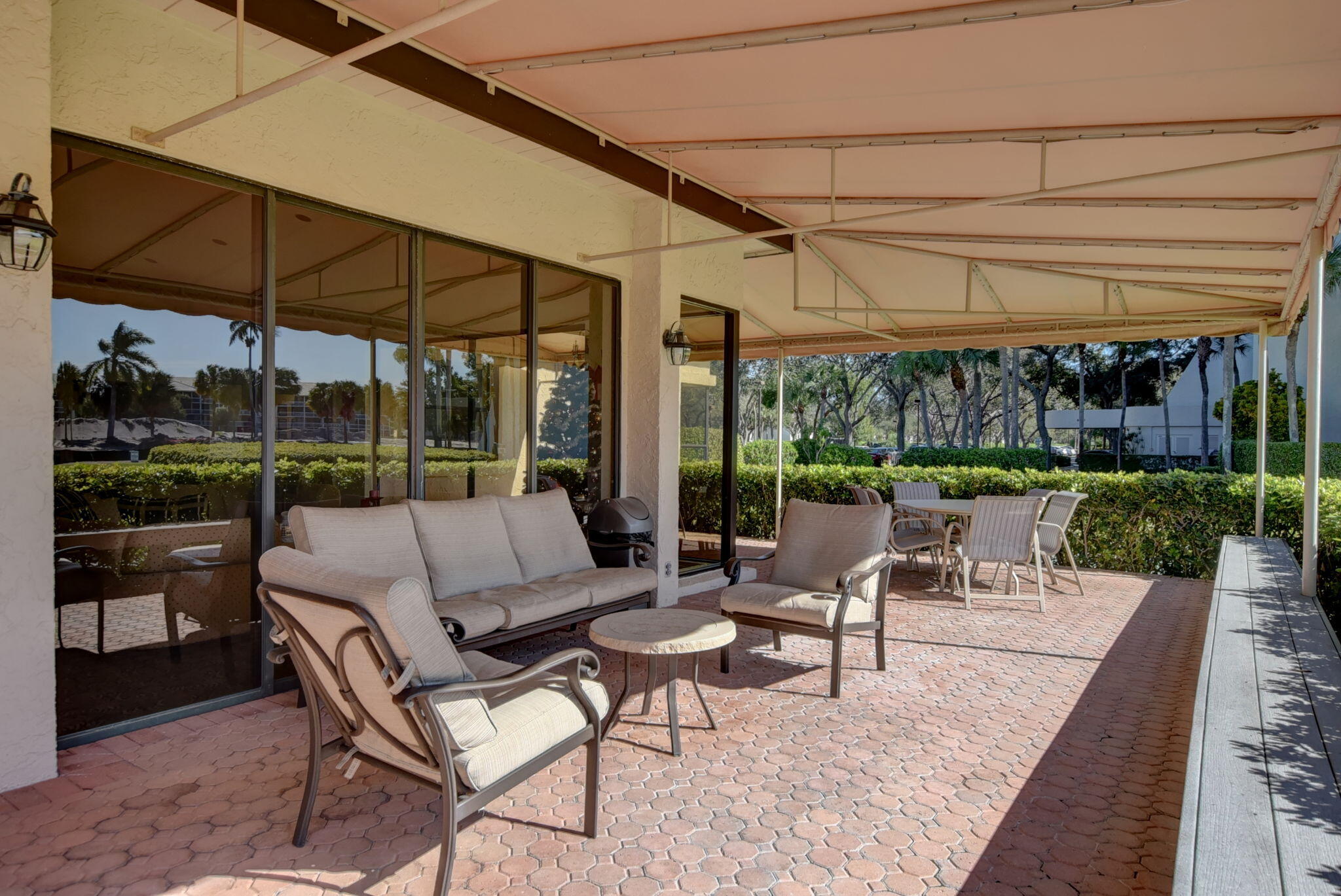 6620 Boca Del Mar Drive, Unit 706 Boca Raton, FL 33433 - Photo 39 of 41 a view of a patio with a table and chairs