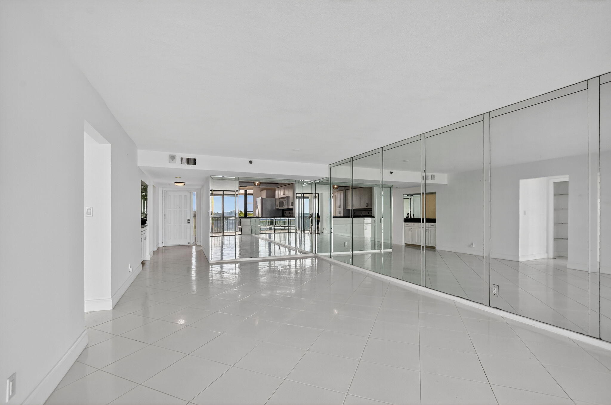 6620 Boca Del Mar Drive, Unit 706 Boca Raton, FL 33433 - Photo 7 of 41 an empty room with cabinet and mirrors