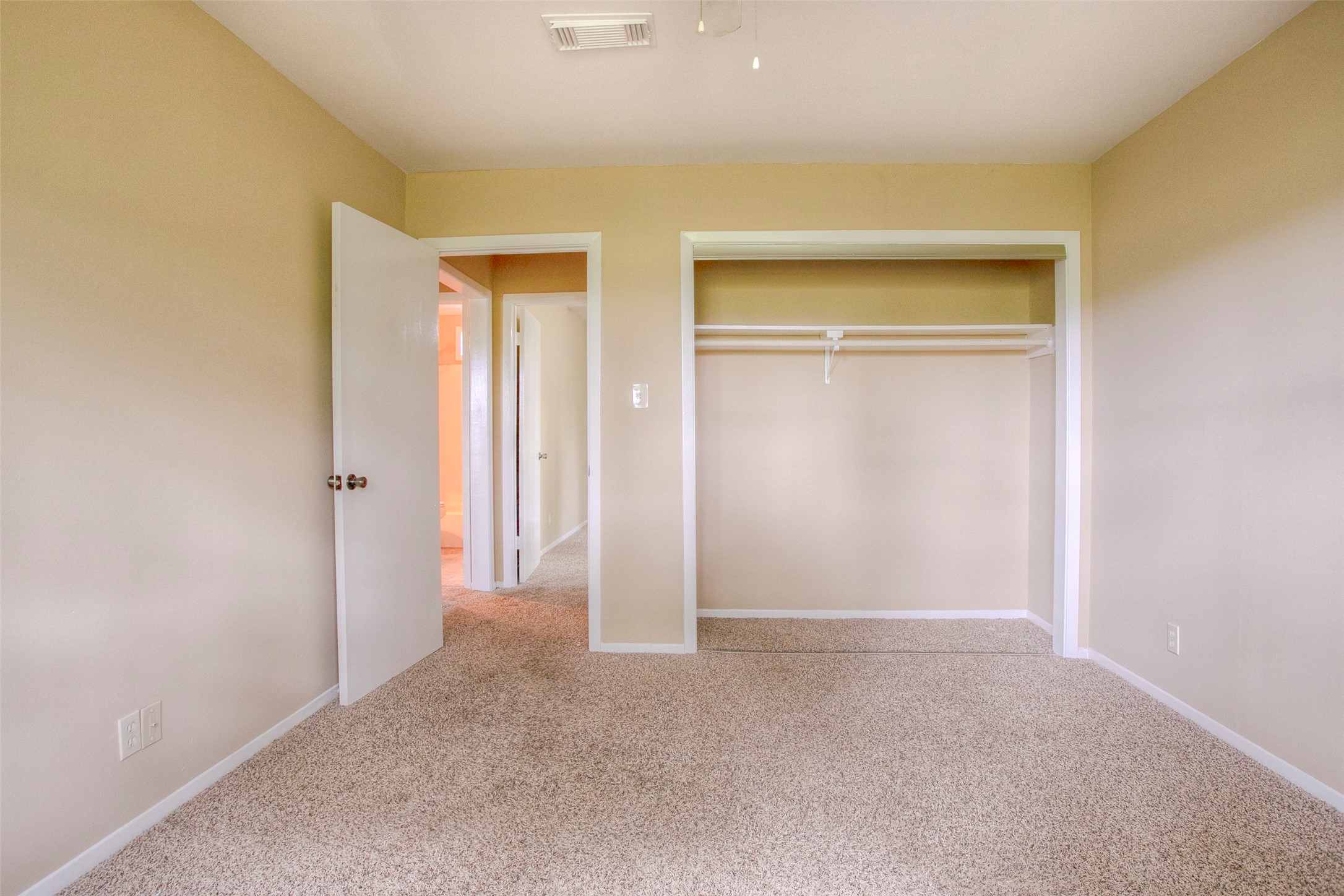 81 Westlake Road Trinity, TX 75862 - Photo 17 of 23 an empty room with closet and a hallway