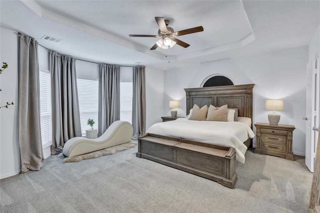 566 Long Meadow Drive Haslet, TX 76052 - Photo 14 of 36 a bedroom with a bed and window