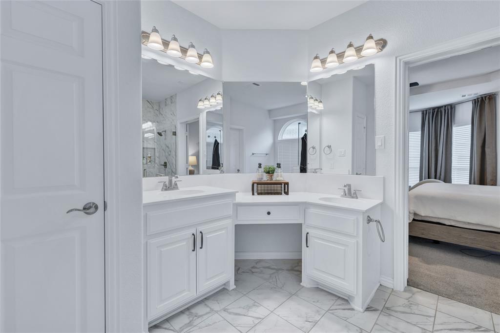 566 Long Meadow Drive Haslet, TX 76052 - Photo 17 of 36 a spacious bathroom with a double vanity sink mirror and double