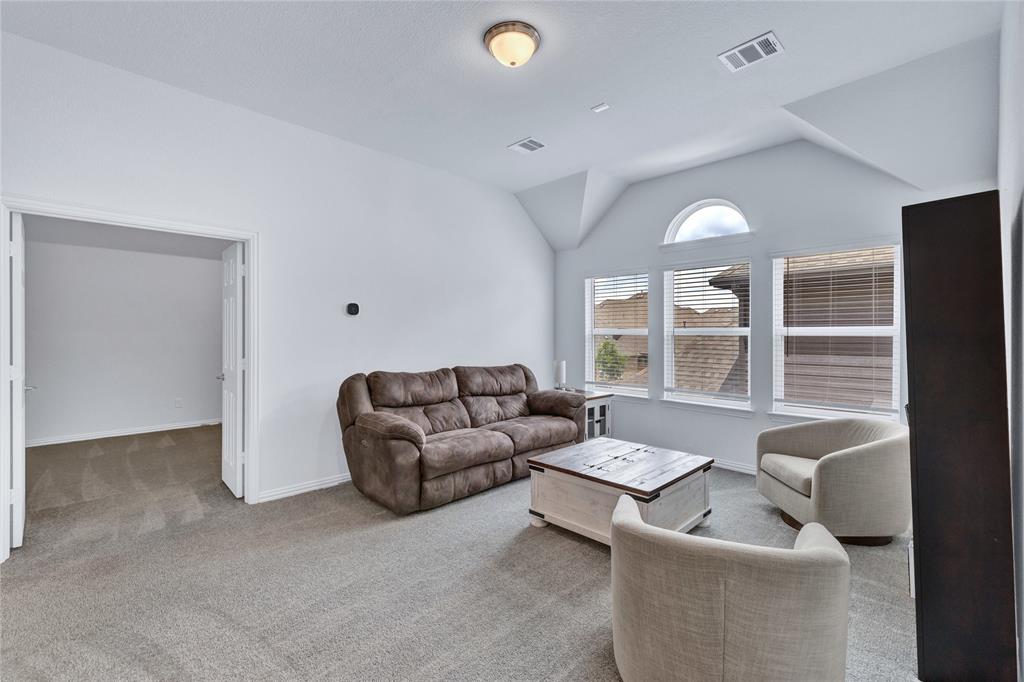 566 Long Meadow Drive Haslet, TX 76052 - Photo 20 of 36 a living room with furniture and a large window