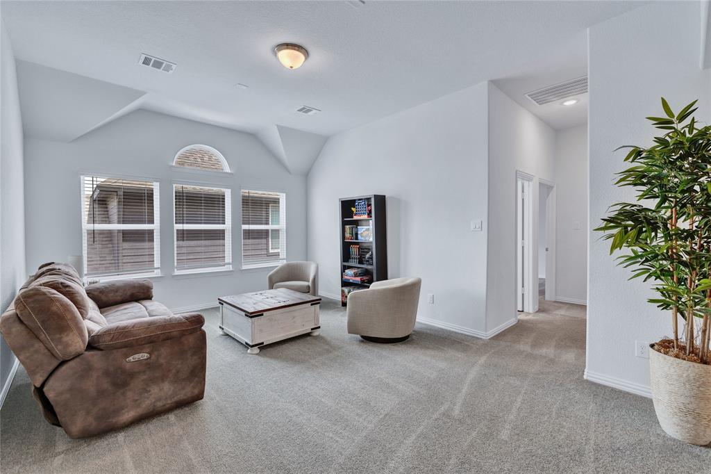 566 Long Meadow Drive Haslet, TX 76052 - Photo 21 of 36 a living room with furniture and potted plant