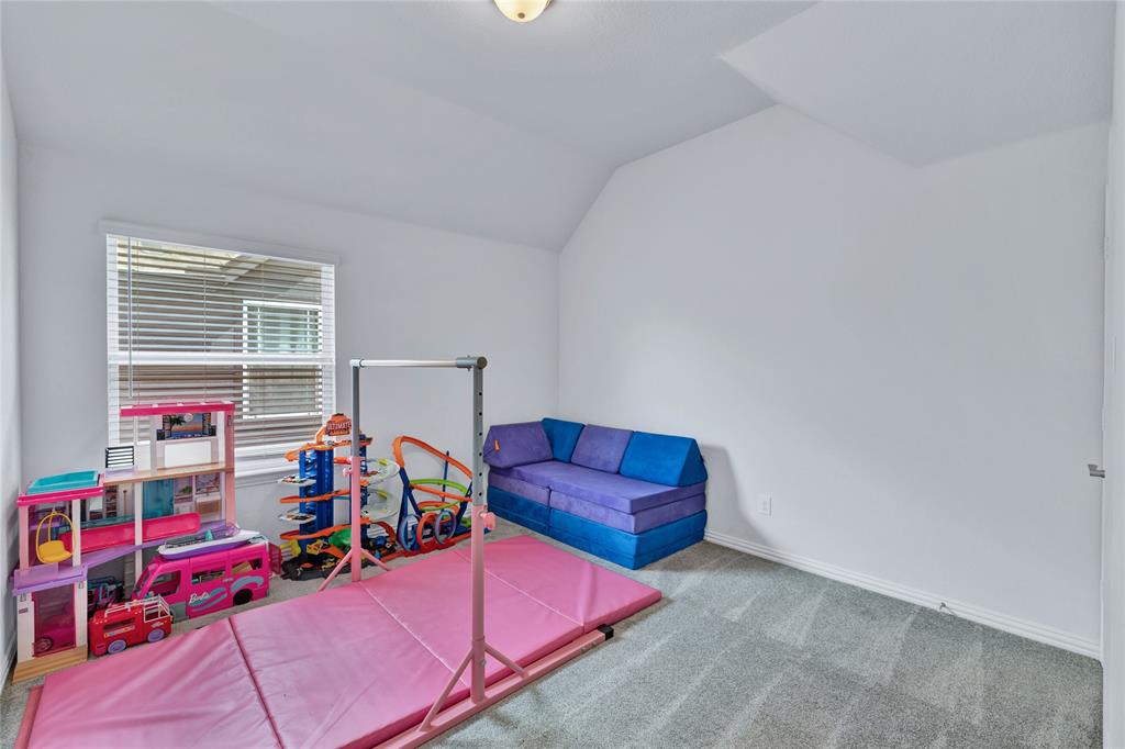 566 Long Meadow Drive Haslet, TX 76052 - Photo 23 of 36 a bedroom with furniture and a window