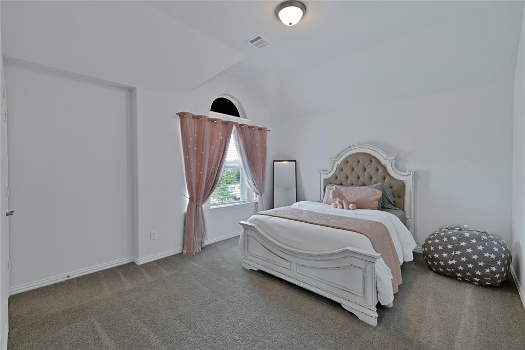 566 Long Meadow Drive Haslet, TX 76052 - Photo 26 of 36 a bedroom with a bed and a window