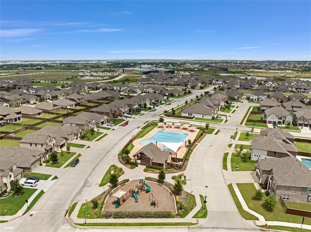 566 Long Meadow Drive Haslet, TX 76052 - Photo 30 of 36 an aerial view of a house with a swimming pool
