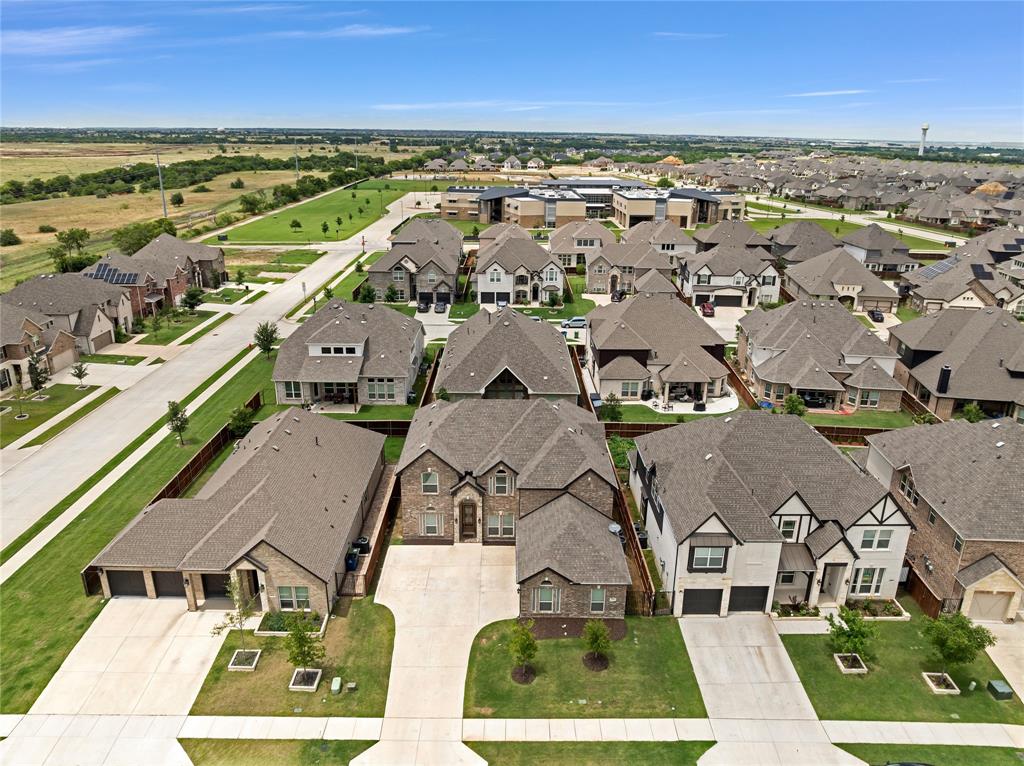 566 Long Meadow Drive Haslet, TX 76052 - Photo 32 of 36 an aerial view of residential houses with outdoor space