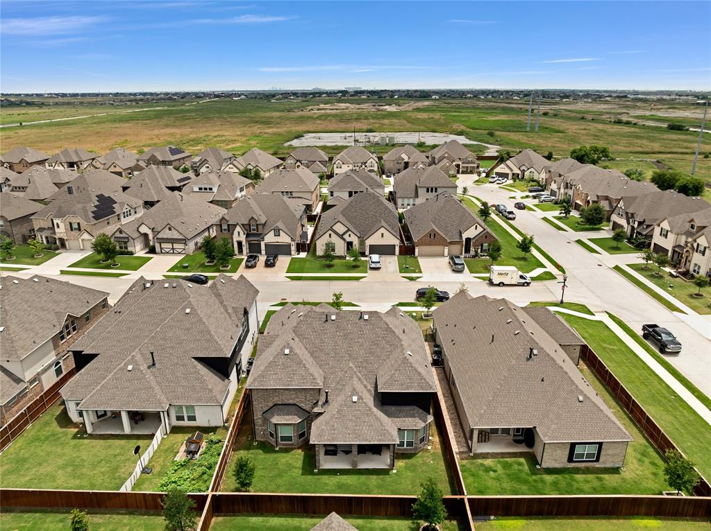 566 Long Meadow Drive Haslet, TX 76052 - Photo 33 of 36 an aerial view of residential houses with outdoor space