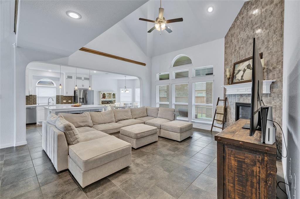 566 Long Meadow Drive Haslet, TX 76052 - Photo 4 of 36 a living room with furniture kitchen view and a large window