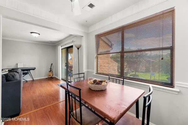 a bedroom with furniture and a large window