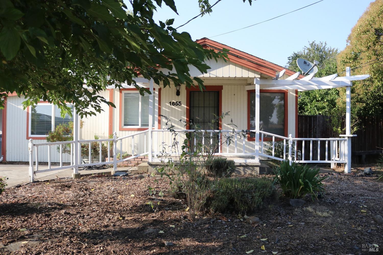 1655 Jennings Avenue Santa Rosa, CA 95401 - Photo 1 of 1 a front view of house with a garden