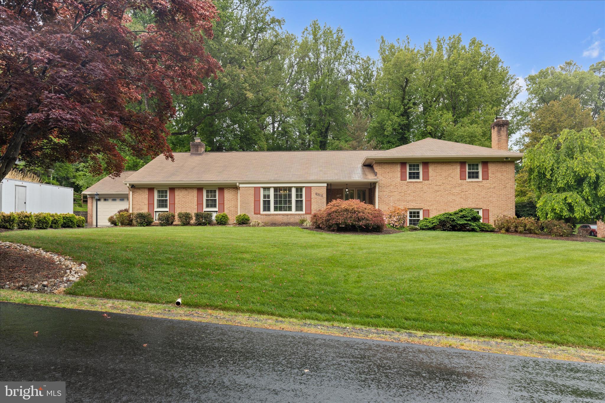 10205 Old Hunt Road Vienna, VA 22181 - Photo 1 of 67 a front view of a house with a garden