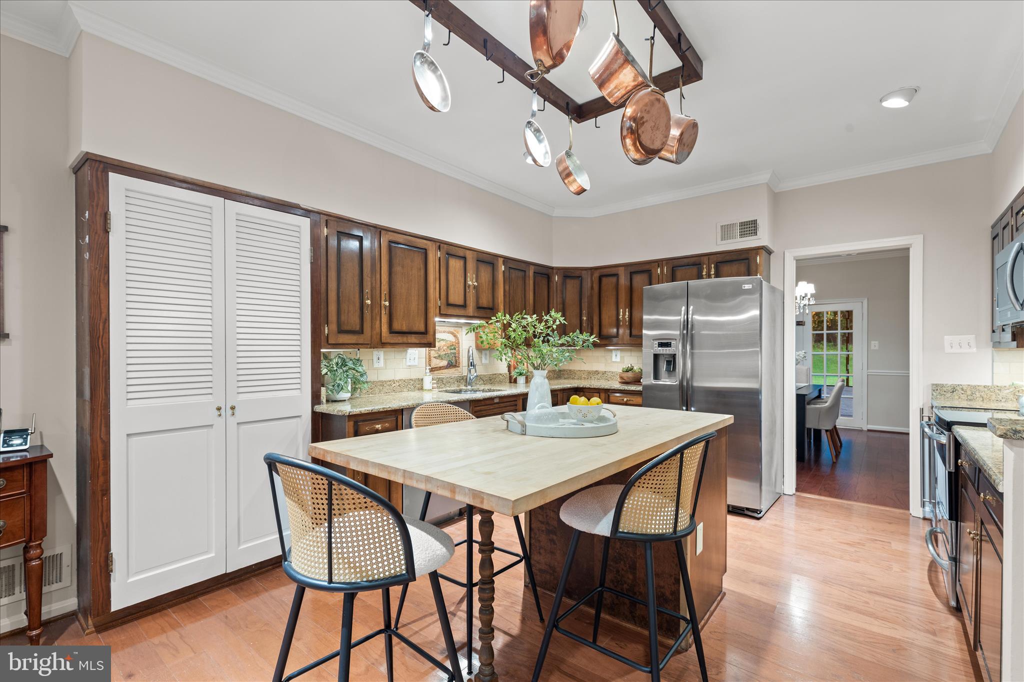 10205 Old Hunt Road Vienna, VA 22181 - Photo 24 of 67 a view of a dining room with furniture and a chandelier