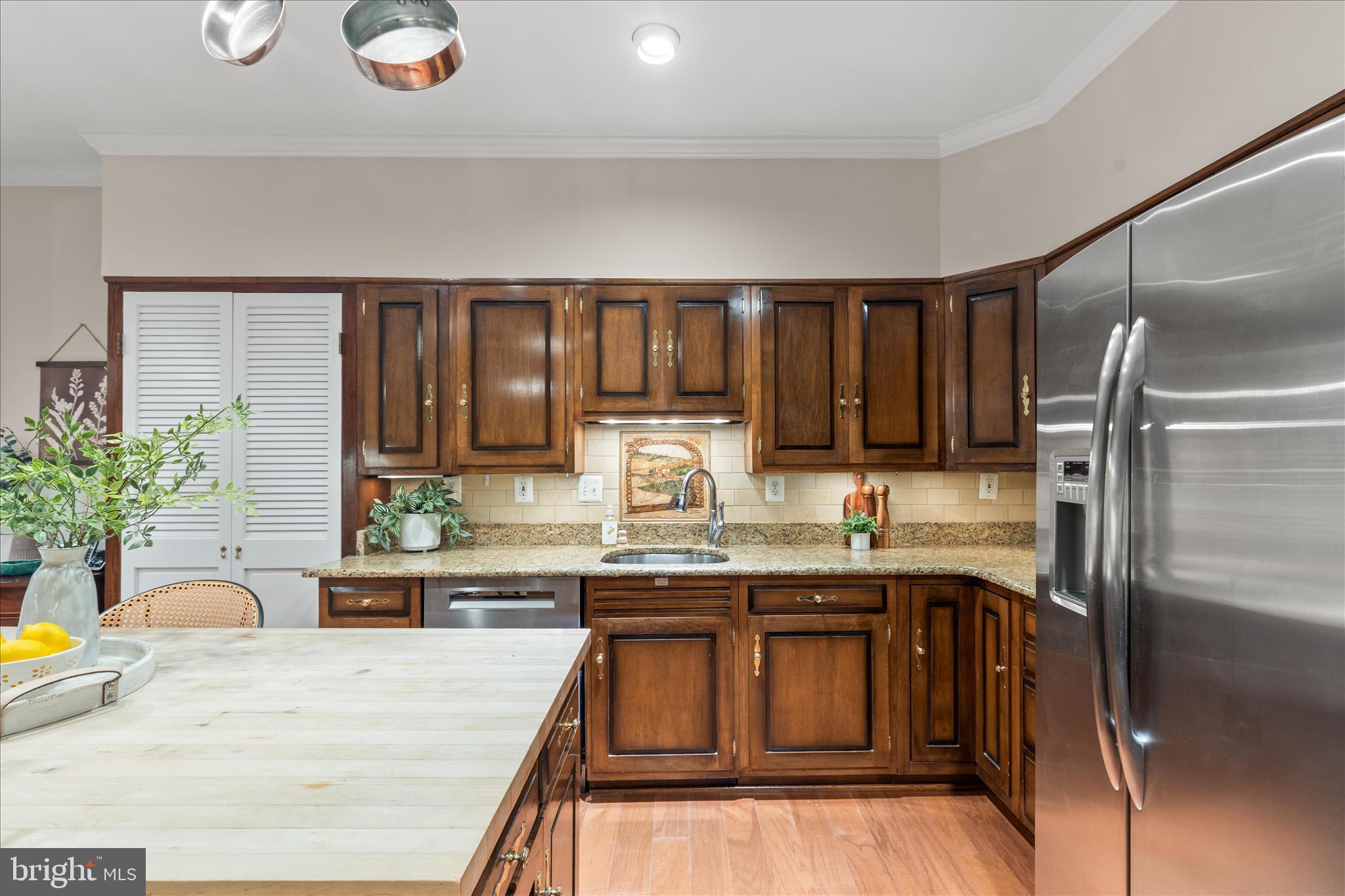 10205 Old Hunt Road Vienna, VA 22181 - Photo 25 of 67 a kitchen with stainless steel appliances granite countertop a sink stove and refrigerator