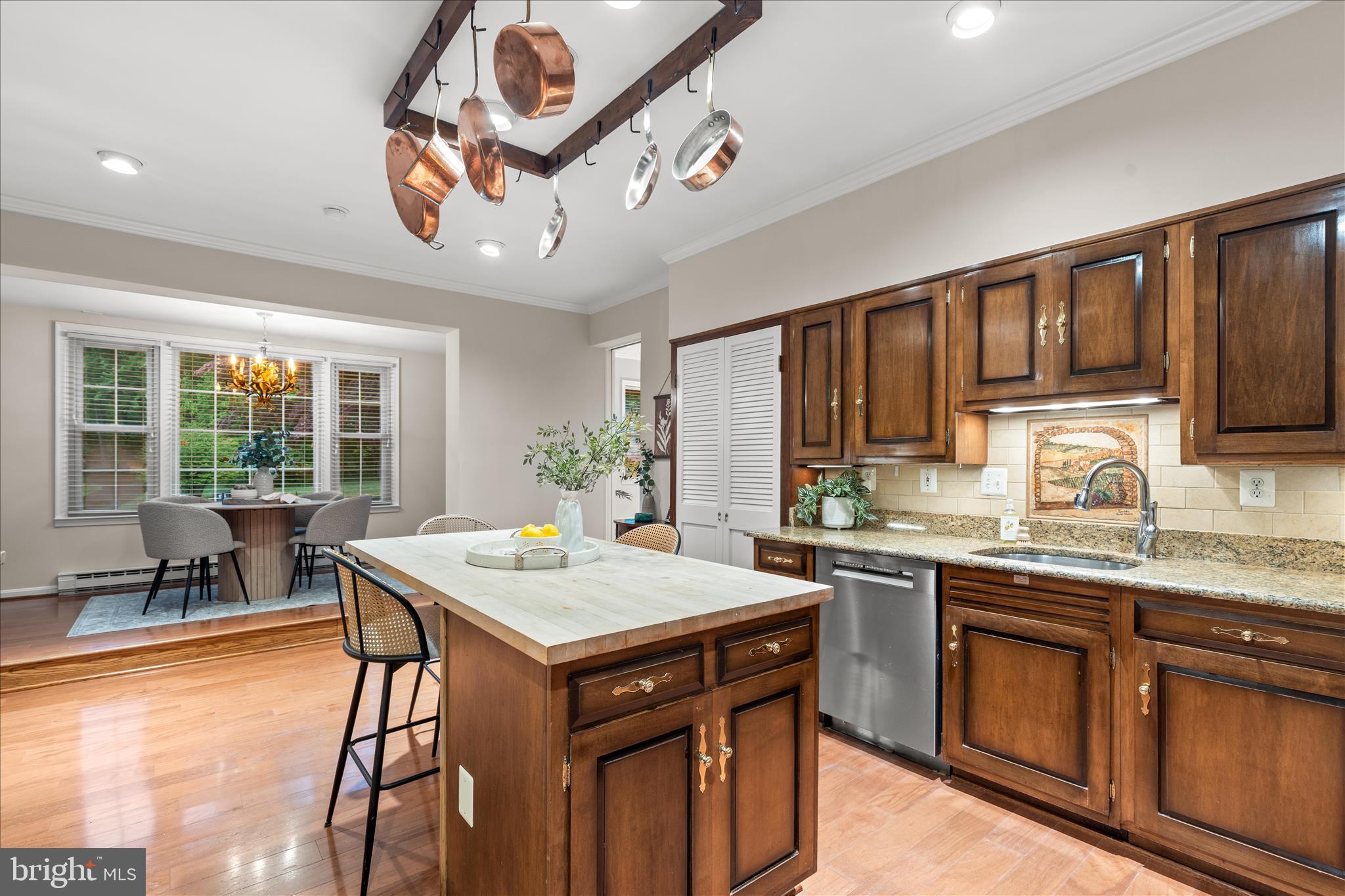 10205 Old Hunt Road Vienna, VA 22181 - Photo 26 of 67 a kitchen with a stove a sink a refrigerator and wooden cabinets