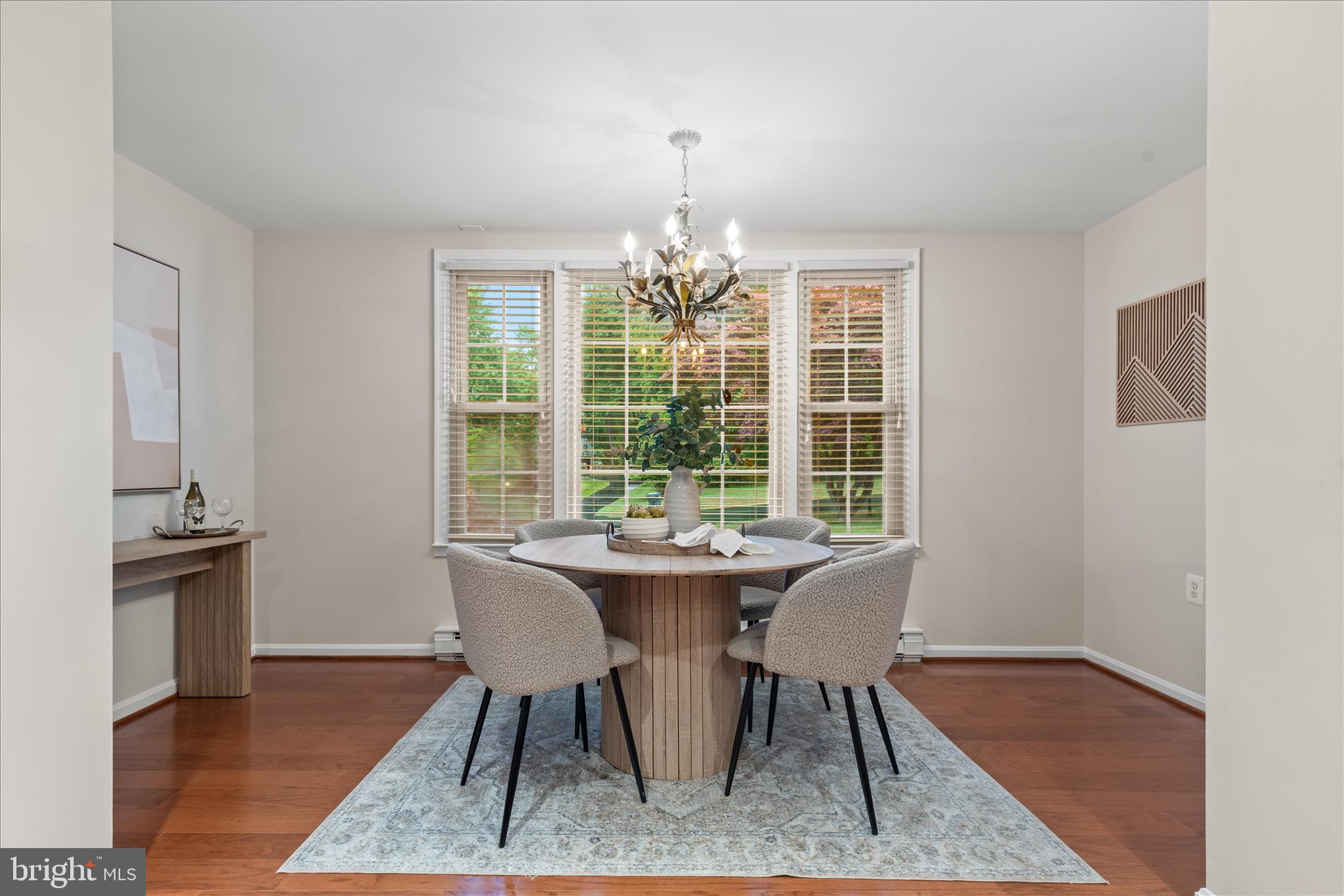 10205 Old Hunt Road Vienna, VA 22181 - Photo 29 of 67 a dining room with furniture wooden floor a rug and a chandelier