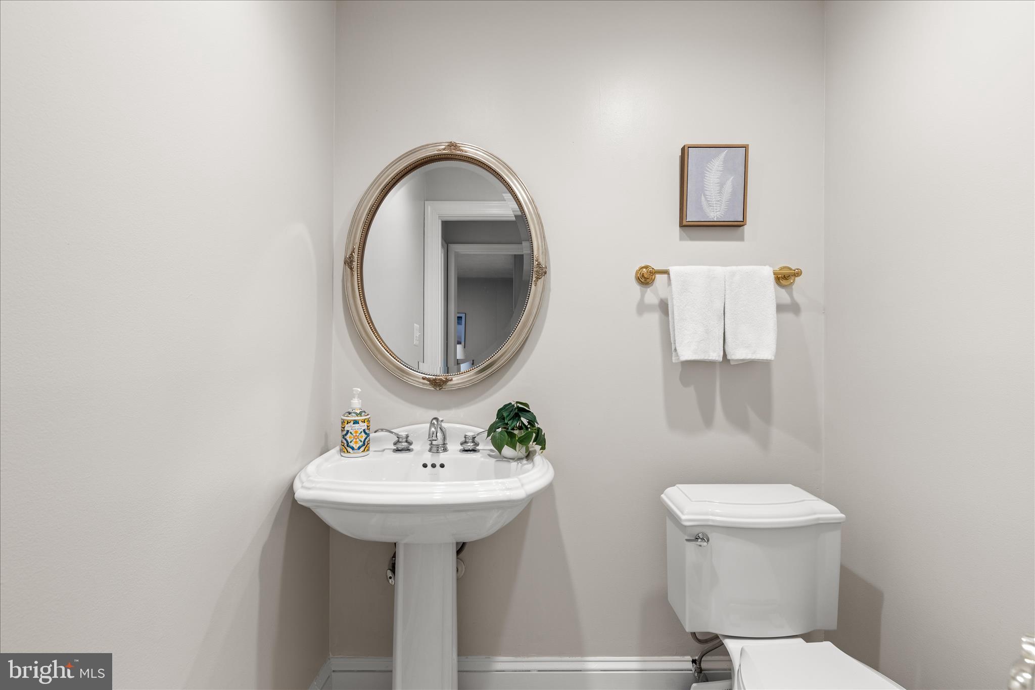 10205 Old Hunt Road Vienna, VA 22181 - Photo 34 of 67 a bathroom with a sink toilet and a mirror
