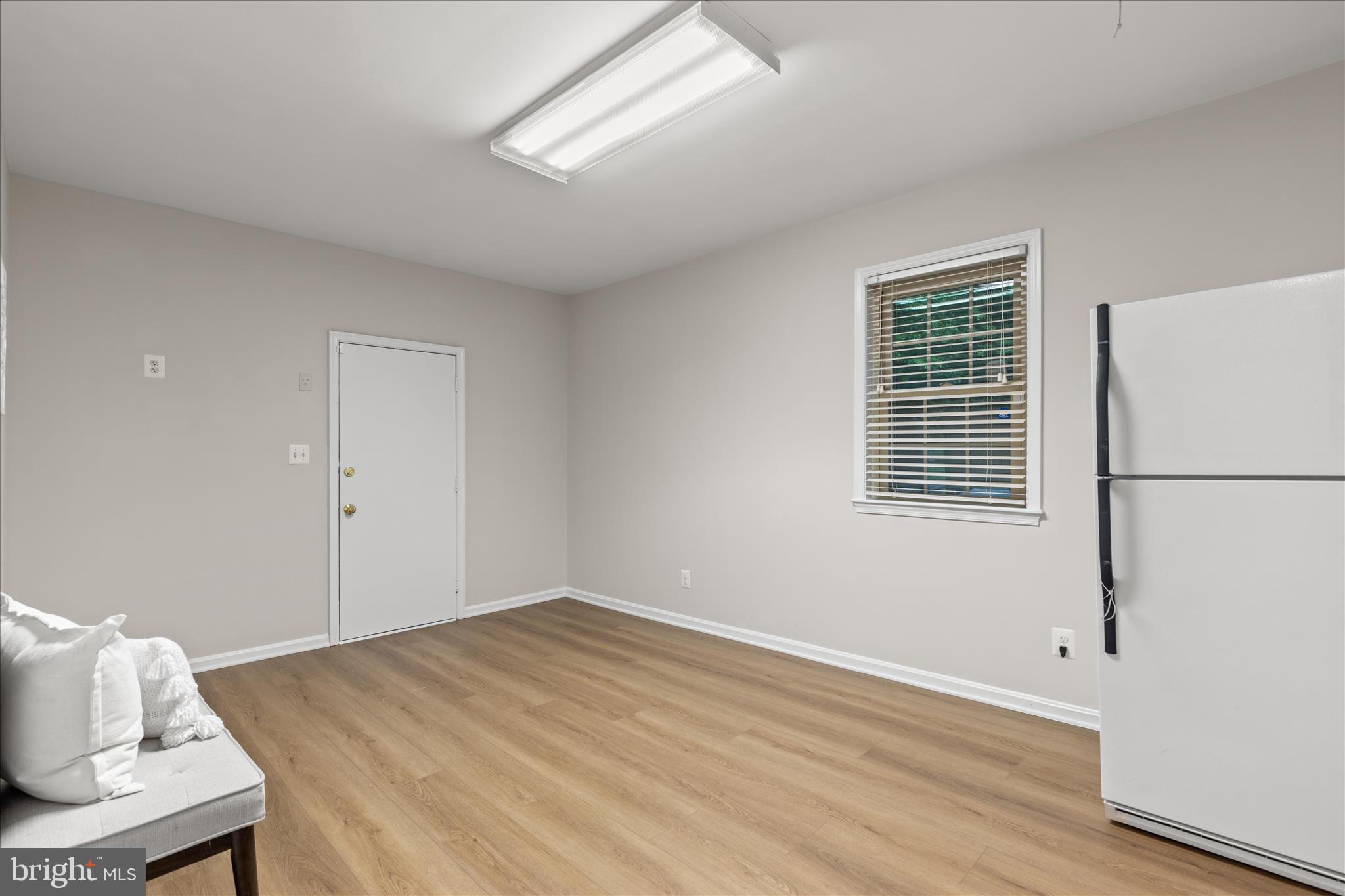 10205 Old Hunt Road Vienna, VA 22181 - Photo 35 of 67 a view of a livingroom with wooden floor and a window