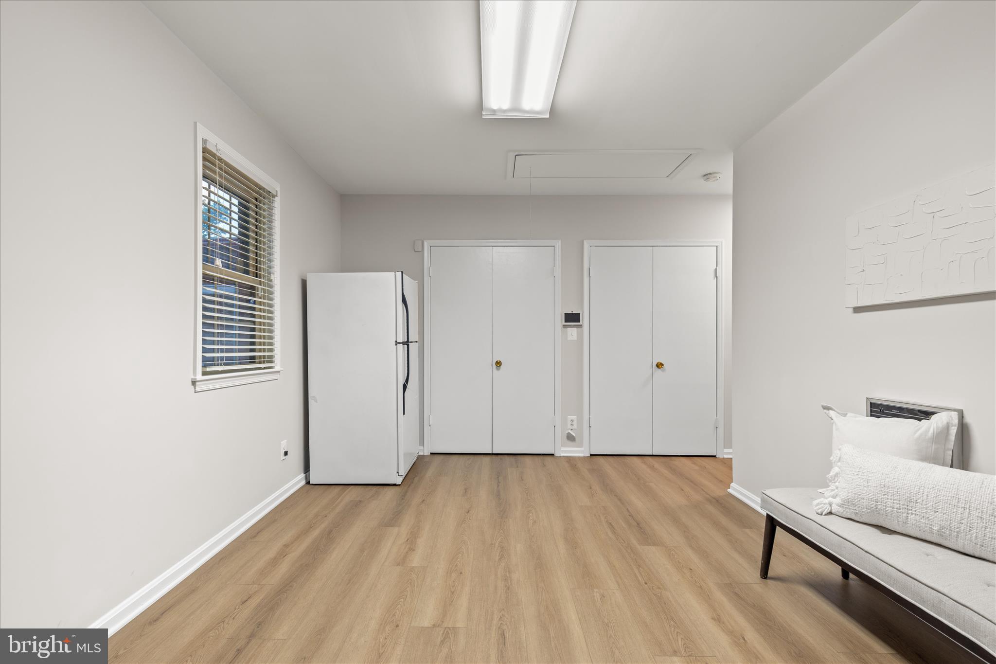 10205 Old Hunt Road Vienna, VA 22181 - Photo 36 of 67 a view of room with hardwood floor and window