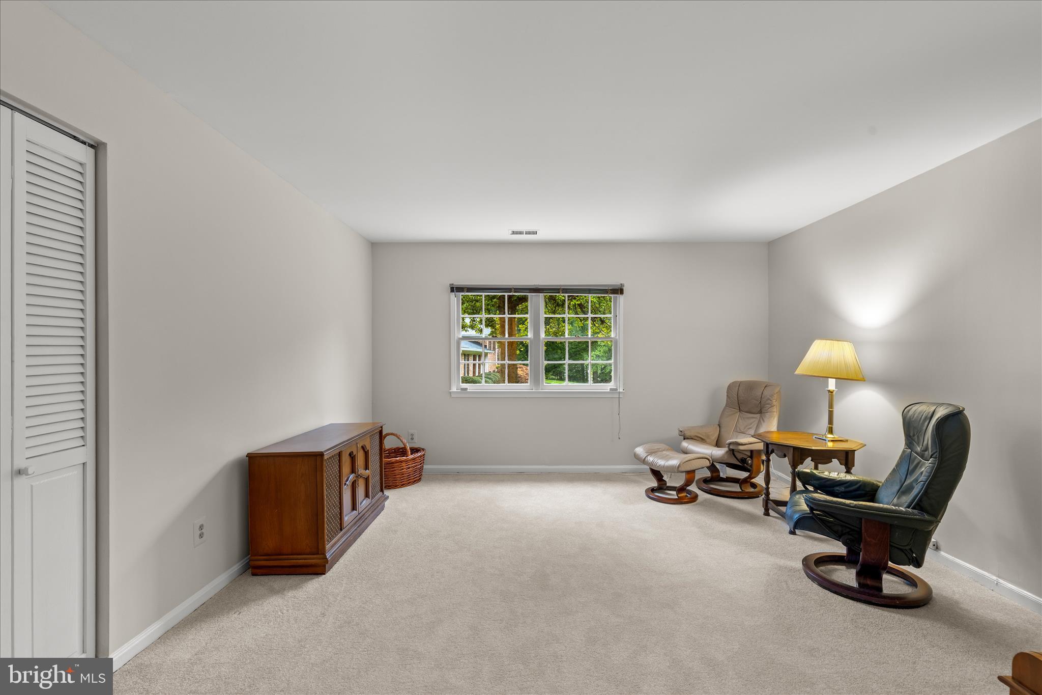 10205 Old Hunt Road Vienna, VA 22181 - Photo 52 of 67 a living room with furniture and a window