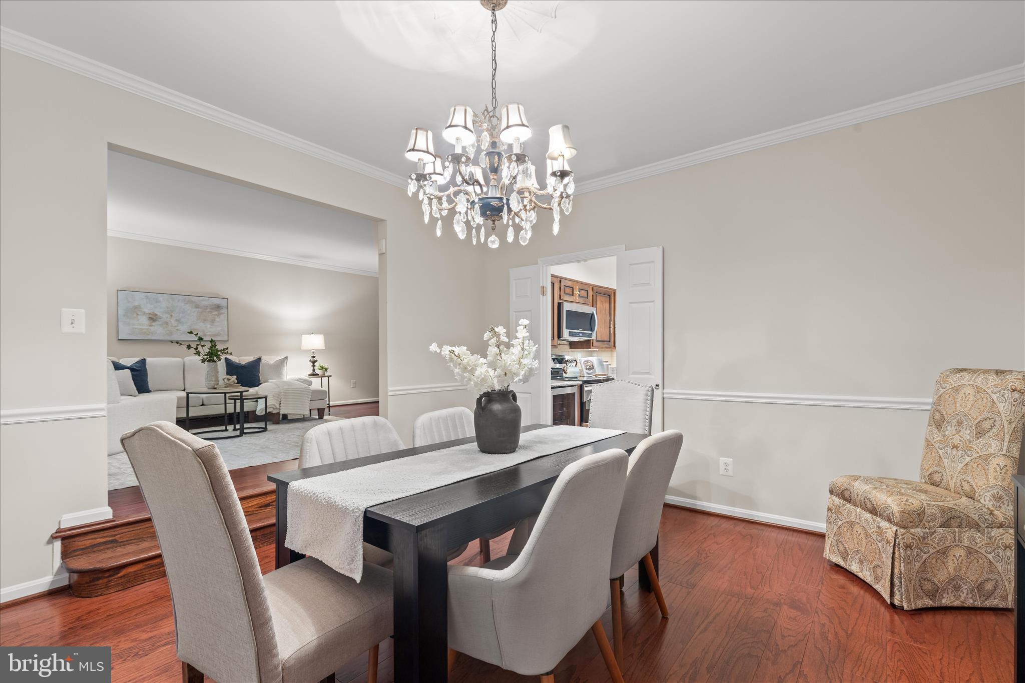 10205 Old Hunt Road Vienna, VA 22181 - Photo 10 of 67 a dining room with furniture a chandelier and wooden floor