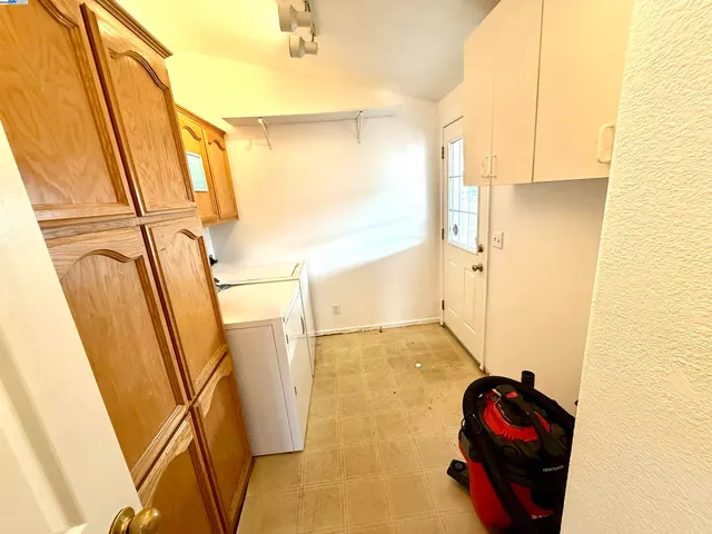 a view of a hallway with stairs