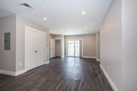 a view of entryway with wooden floor