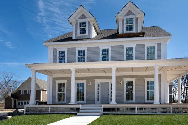 a front view of a house with a yard
