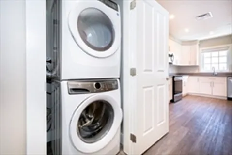 a view of a kitchen with washer and dryer